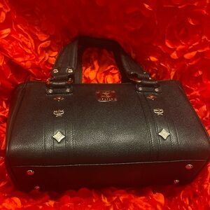 MCM Black Satchel Top Handle Bag Gold Hardware Logo Accent Red Interior